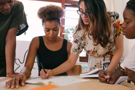 A group of woman learning with a coach